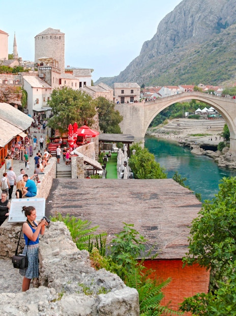 Crowded street market near the historic Old Bridge in Mostar, Bosnia and Herzegovina.