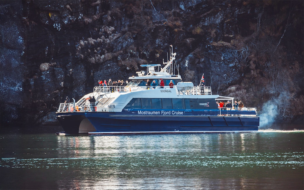 People enjoying the Mostraumen Fjord Cruise in Norway.