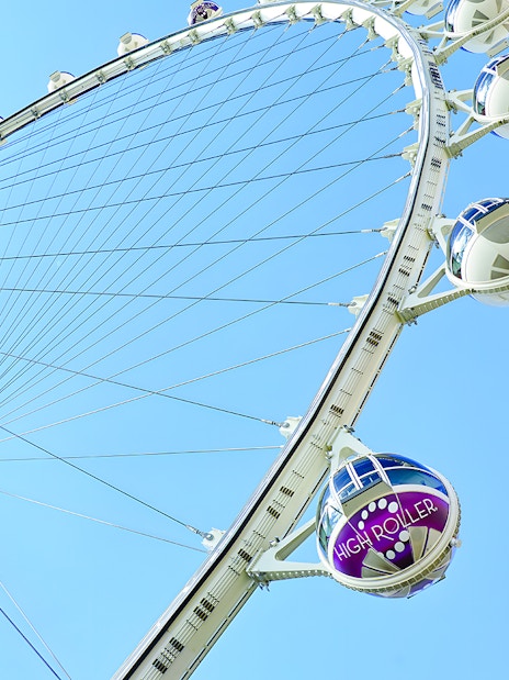 High Roller Wheel in Las Vegas against a clear blue sky.