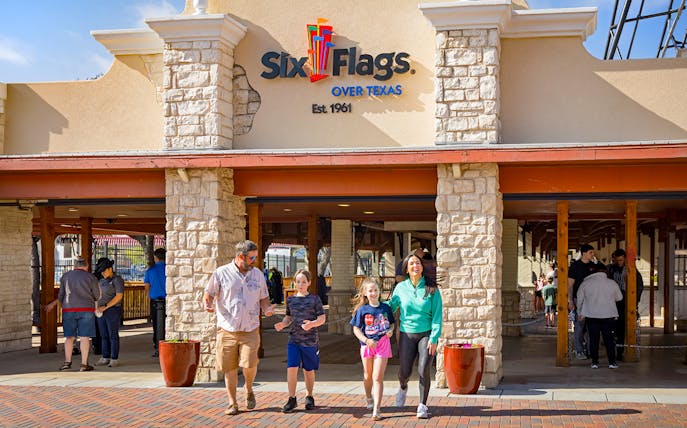 Visitors entering Six Flags Over Texas through the main gate.