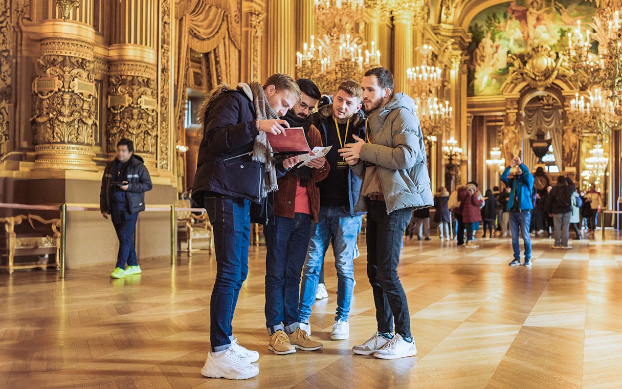 Visitors engage in the Arsene Lupin Immersive Game at Garnier Opera, Paris.