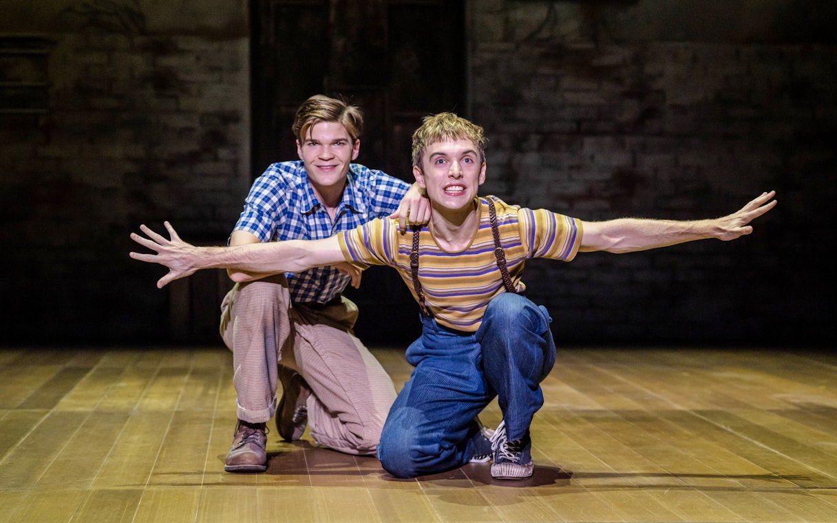 Actors performing a scene from "To Kill a Mockingbird" on West End stage.