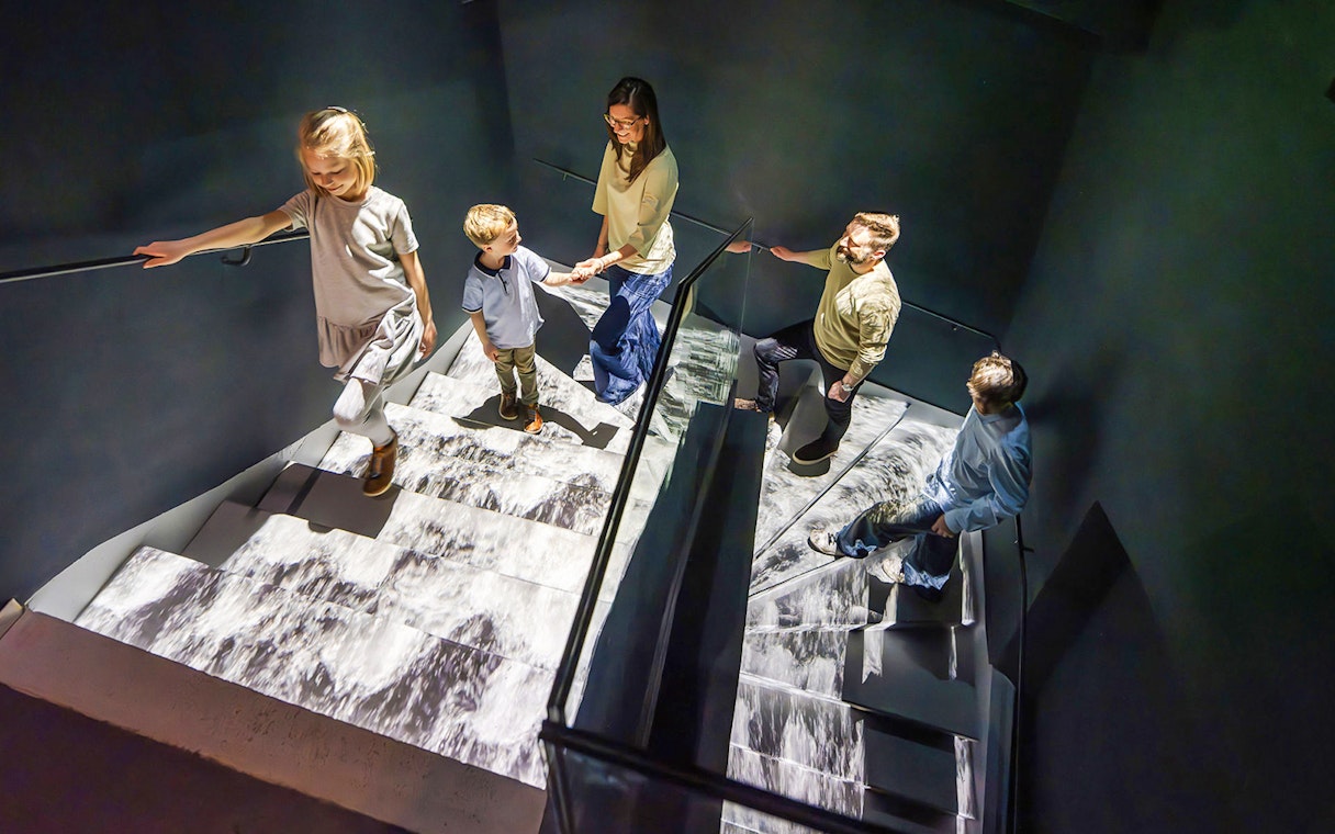 Guests exploring stairs at Praga Magica Interactive Exhibition.