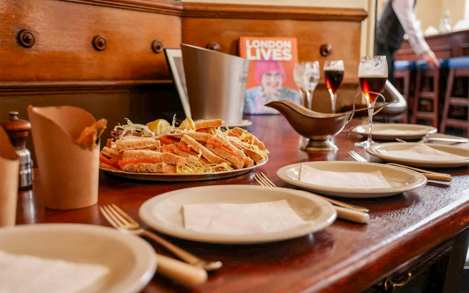 Sandwich platter and drinks on a table during Eating London: Heart of 'The City' Food Tour.