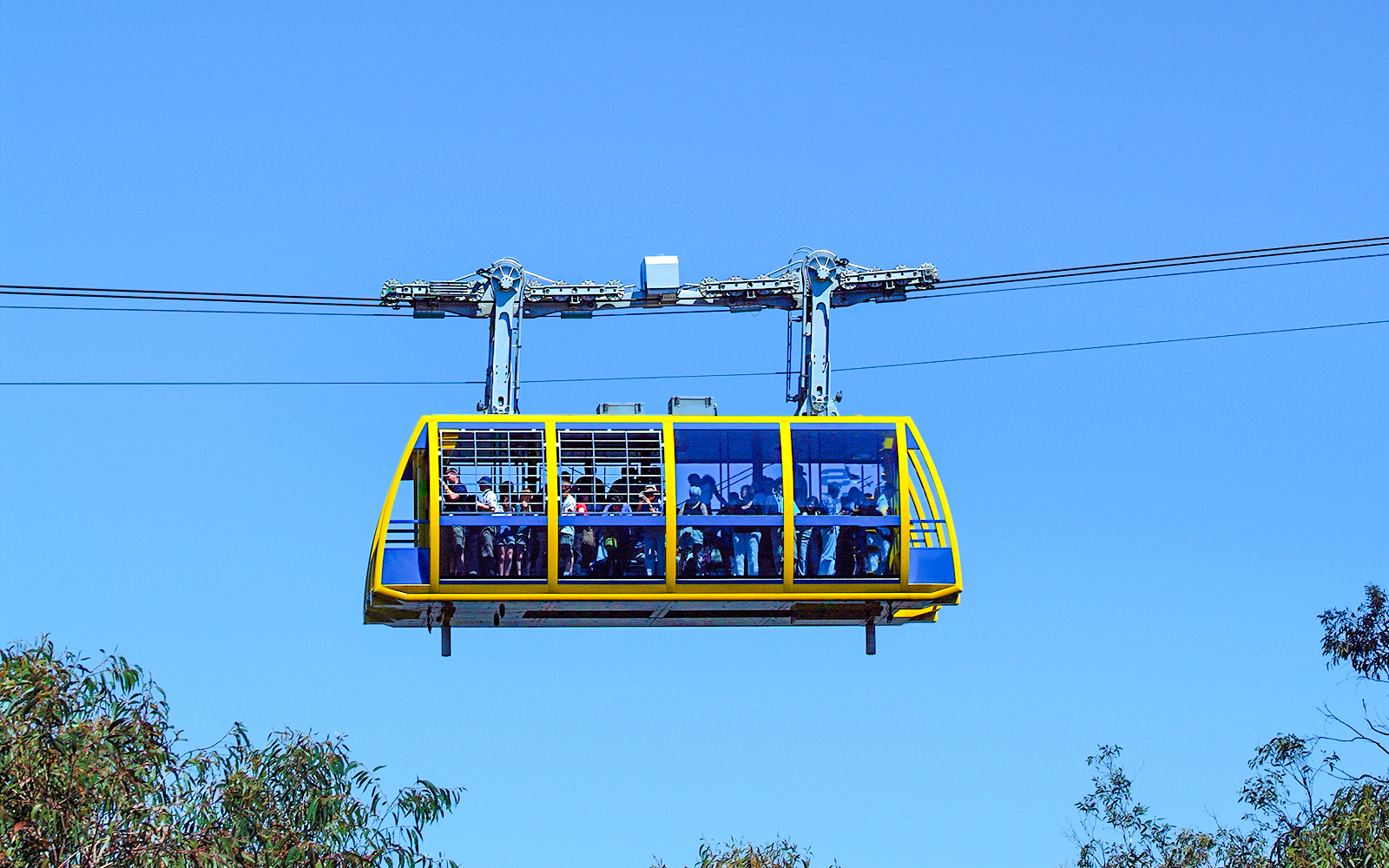Skyway cable car at Scenic World, Blue Mountains, with passengers enjoying the view.