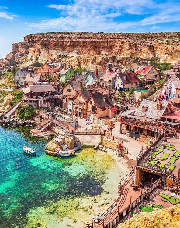 Popeye Village colorful wooden houses by the sea in Malta.