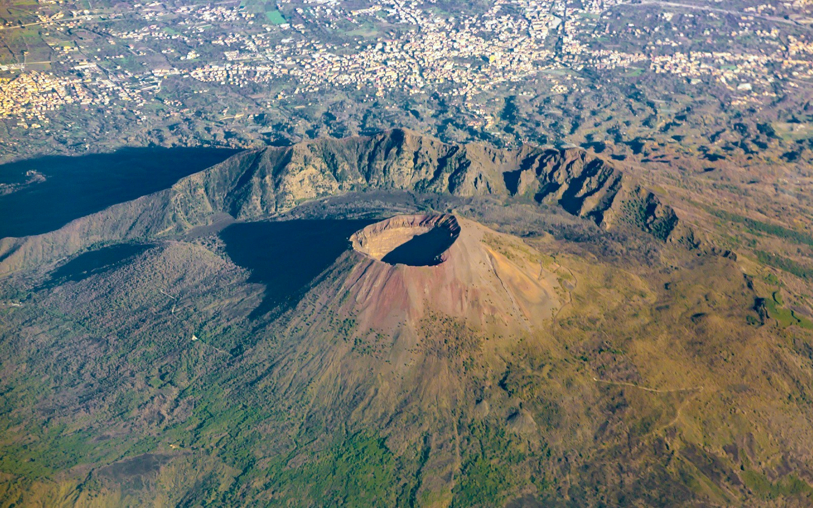 Aerial view of Mount Vesuvius, Italy, showcasing the crater and surrounding landscape.