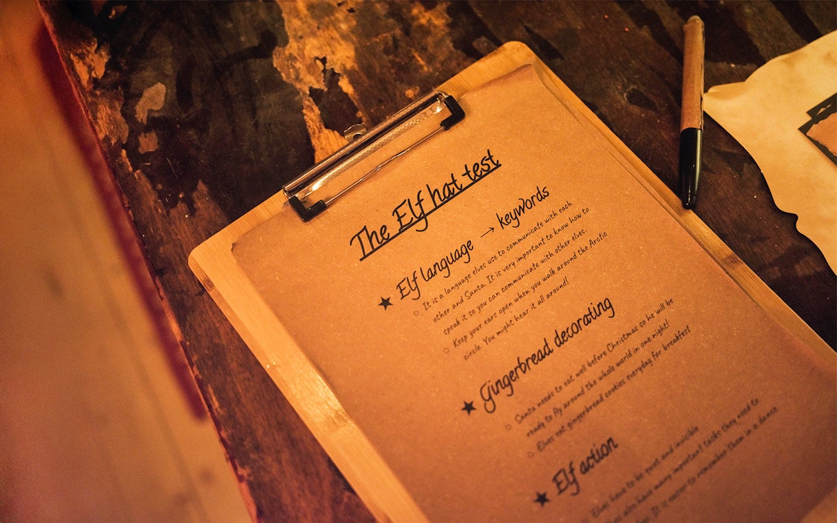Elf Hat Academy test instructions on clipboard at Santa's Village.
