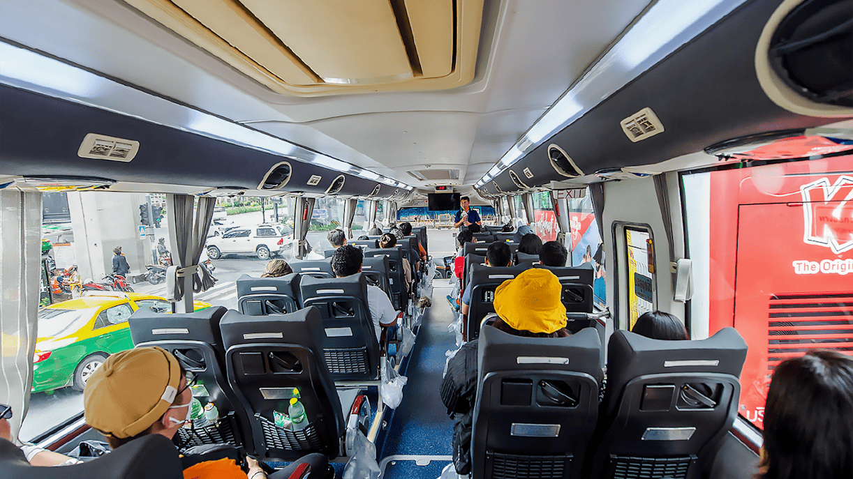 Passengers seated inside an AC coach during Ayutthaya Temples guided half-day tour.