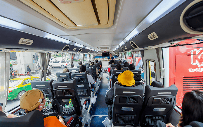 Passengers seated inside an AC coach during Ayutthaya Temples guided half-day tour.