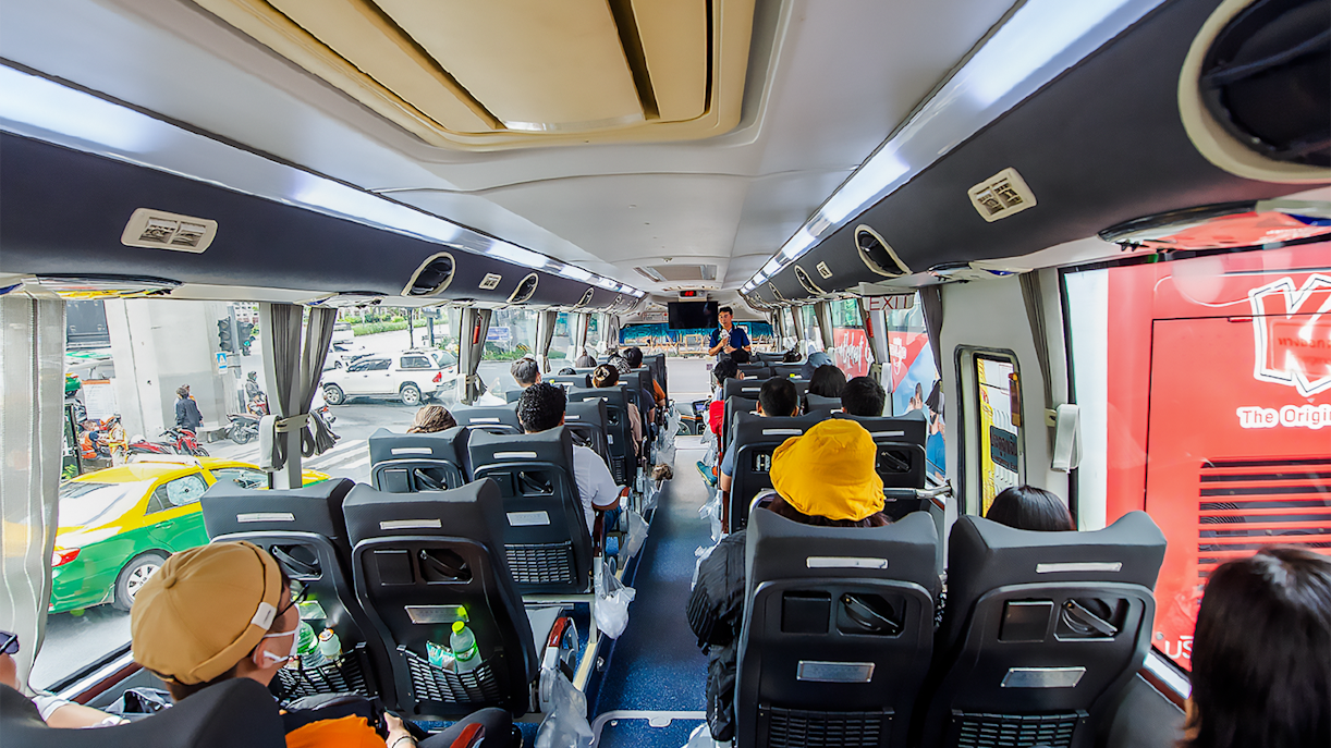 Passengers seated inside an AC coach during Ayutthaya Temples guided half-day tour.
