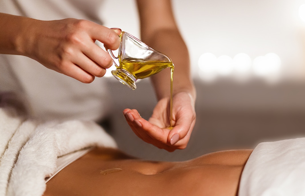 Relaxing oil massage therapy session in a serene spa setting.