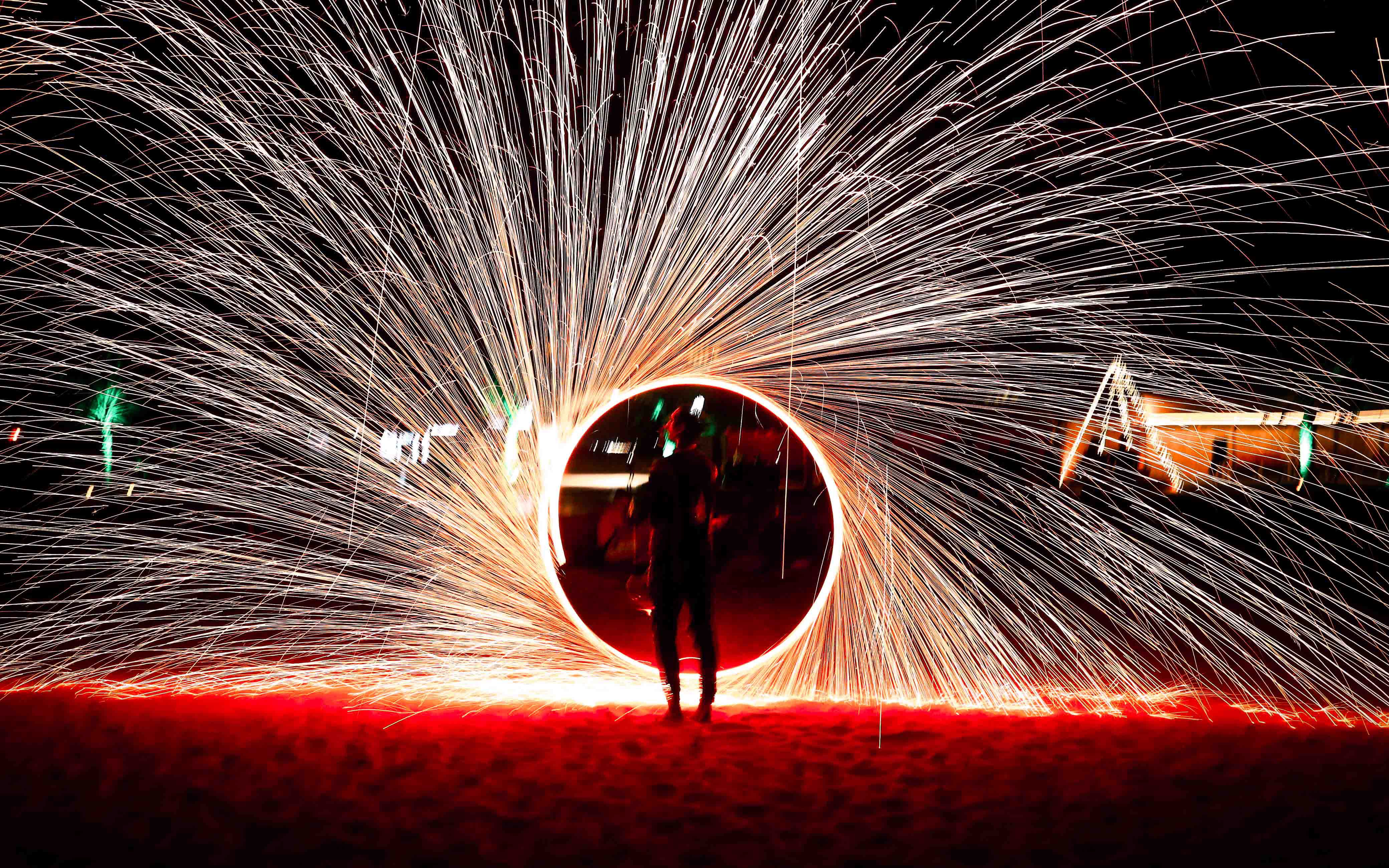 Steel wool fire show during overnight desert safari in Abu Dhabi.