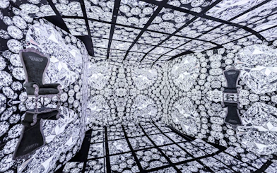 MIRACLEWORLD Osaka room with diamond-patterned walls and two ornate chairs.