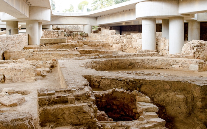 Excavation site beneath the New Acropolis Museum in Athens, Greece, showcasing ancient ruins.