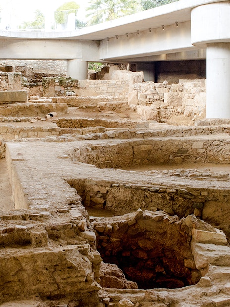 Excavation site beneath the New Acropolis Museum in Athens, Greece, showcasing ancient ruins.