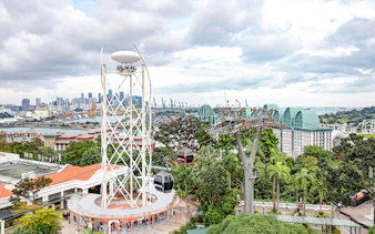 SkyHelix Sentosa ride with panoramic views of Singapore skyline and cable cars.