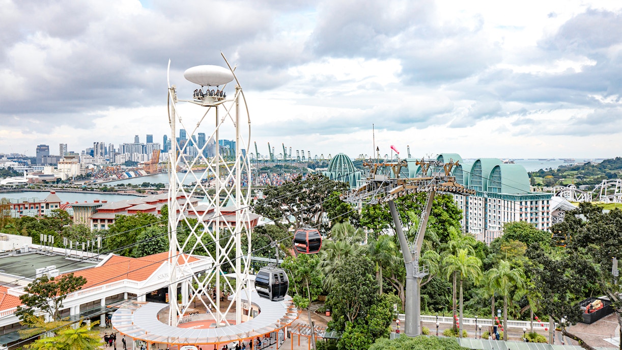 SkyHelix Sentosa ride with panoramic views of Singapore skyline and cable cars.