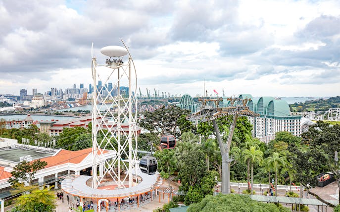 SkyHelix Sentosa ride with panoramic views of Singapore skyline and cable cars.