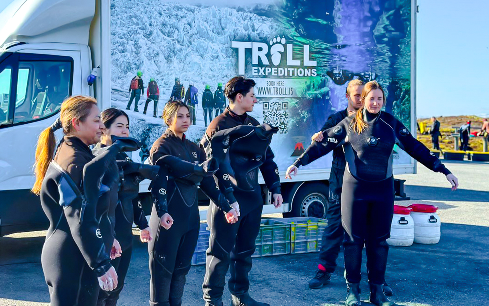 Guests preparing for snorkeling in Silfra Fissure, Iceland, wearing dry suits.