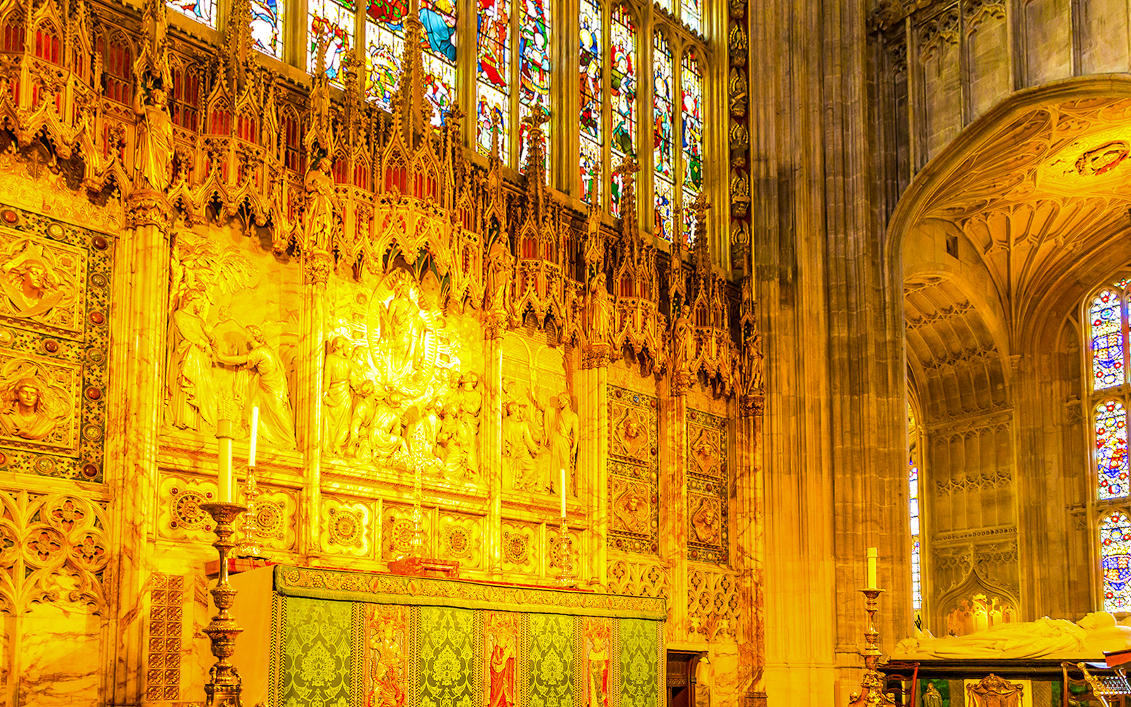 St George's Chapel altar with intricate carvings and stained glass windows, Windsor, England.