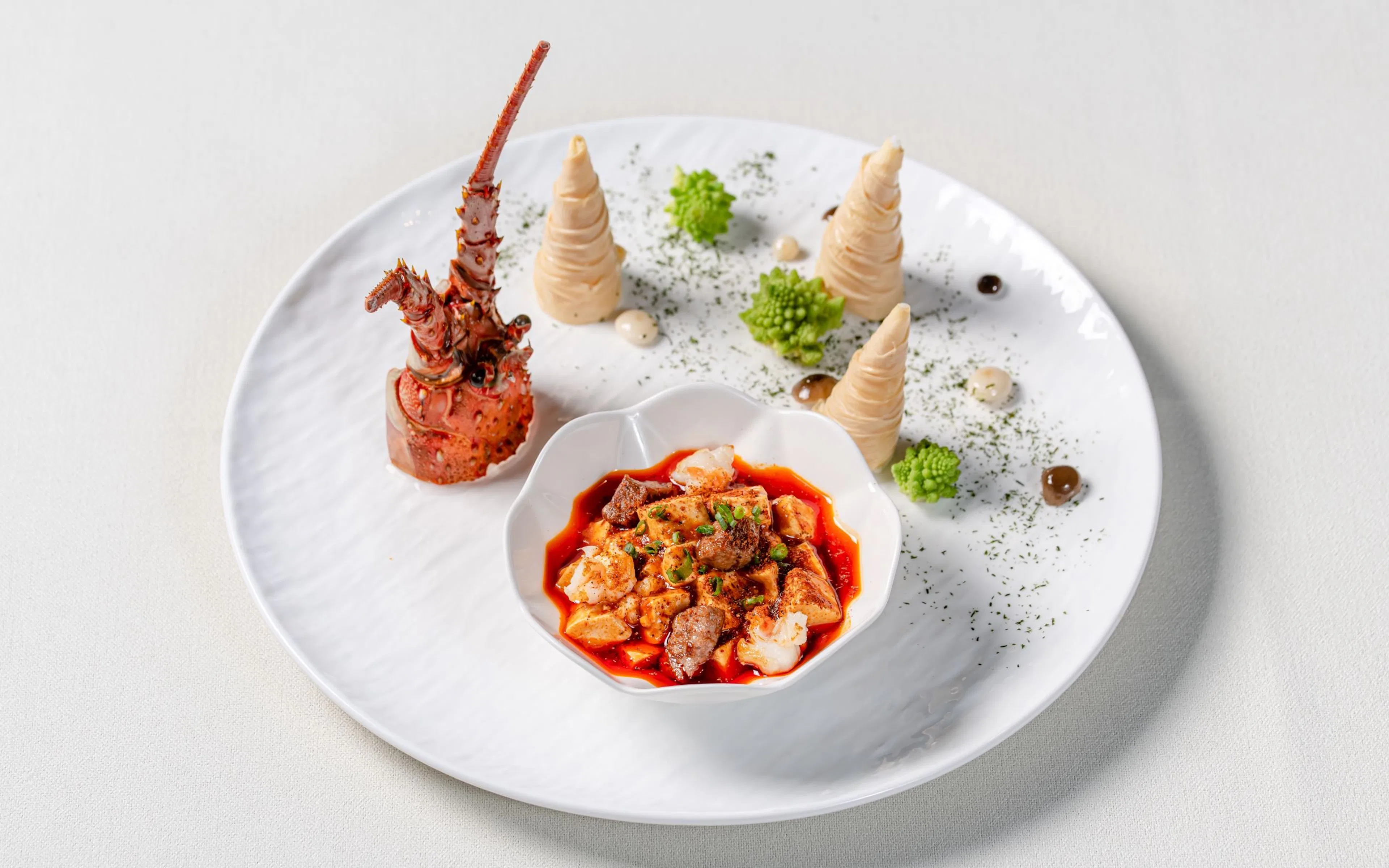 Curated dish at "Taste of China" Immersive Restaurant, Shanghai, featuring lobster and spicy stew.