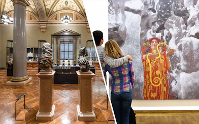 Art Chamber in Kunsthistorisches Museum Vienna with sculptures and visitors viewing a painting.