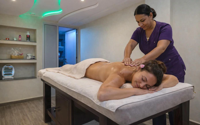 Woman receiving a massage in a spa setting during Agadir 2-hour hammam experience.