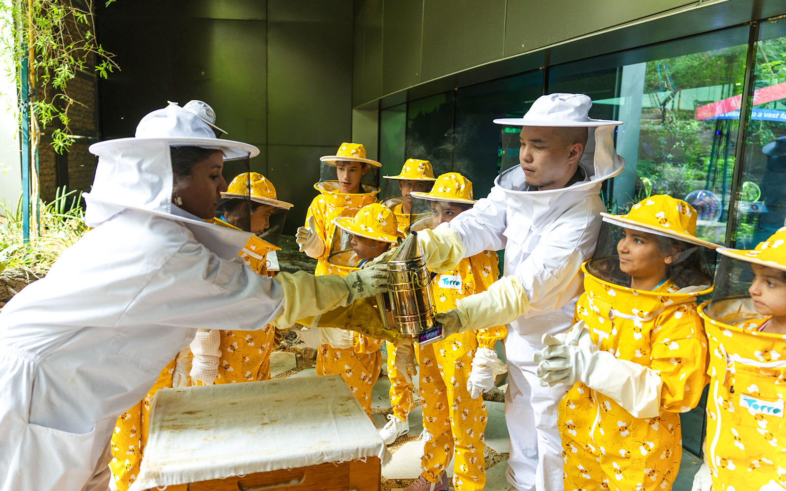 Beekeeping workshop with participants in protective gear at Terra, Expo City Dubai.