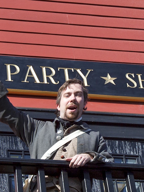 Reenactor in period costume at Boston Tea Party Ship and Museum.