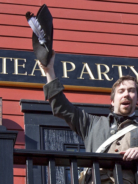 Reenactor in period costume at Boston Tea Party Ship and Museum.