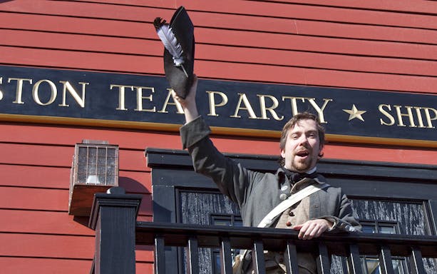 Reenactor in period costume at Boston Tea Party Ship and Museum.