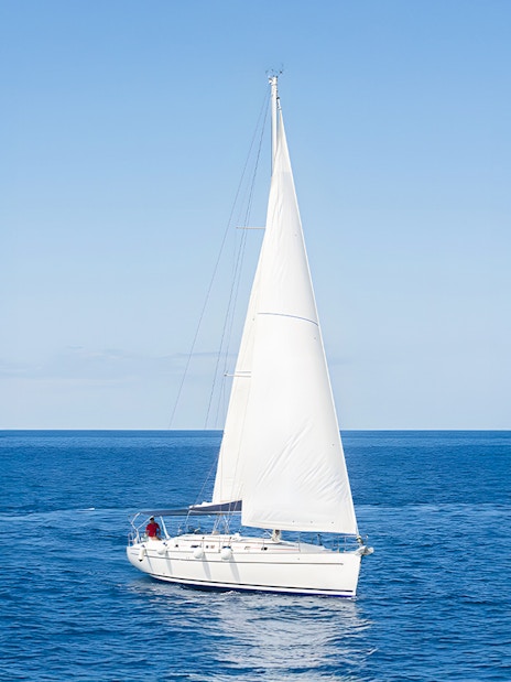 Sailboat cruising on the ocean during a whale and dolphin watching tour in Tenerife.