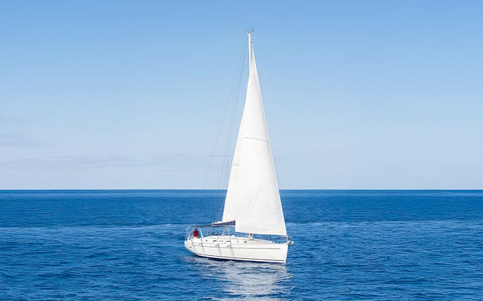 Sailboat cruising on the ocean during a whale and dolphin watching tour in Tenerife.