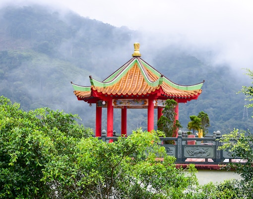 Chin Swee Caves Temple with intricate pagoda and lush forest backdrop in Genting Highlands, Malaysia.