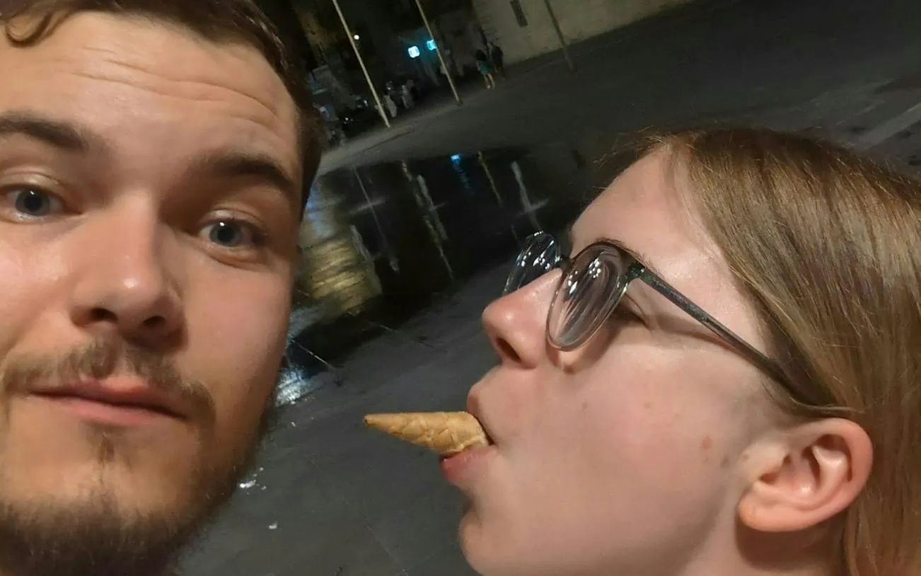 Two people enjoying a playful moment during the Valletta Time Traveler Knights Treasure Hunt.