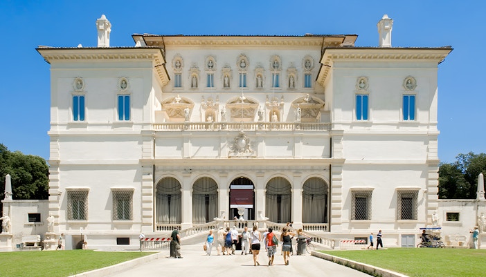 Borghese Gallery interior with classical sculptures and Renaissance paintings, Rome, Italy.