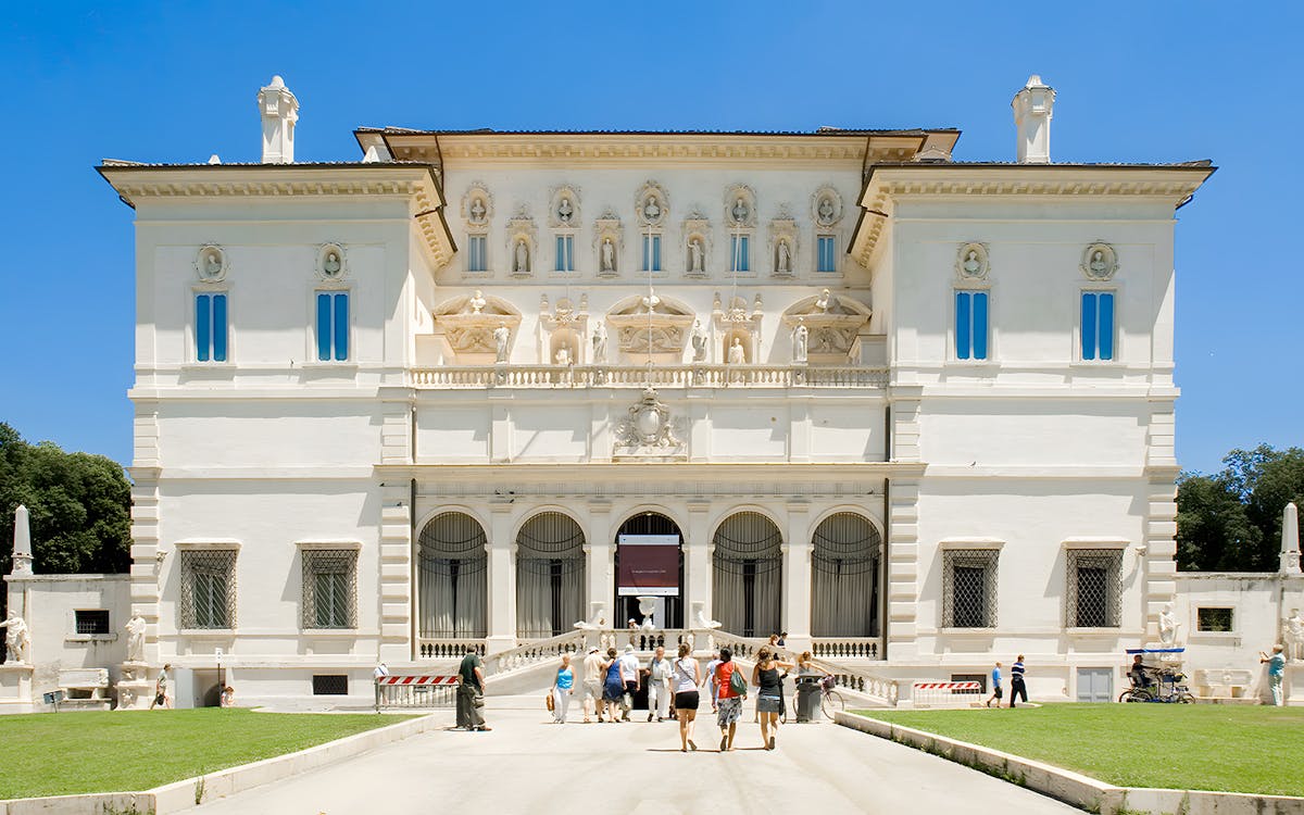 Borghese Gallery interior with classical sculptures and Renaissance paintings, Rome, Italy.