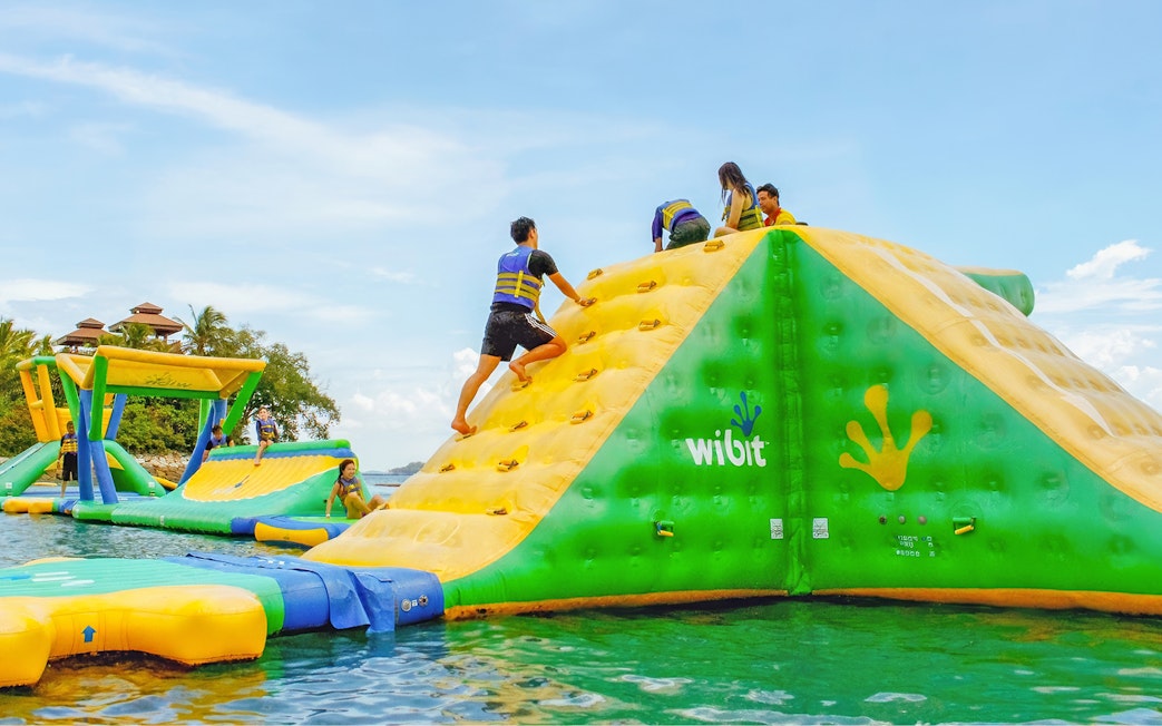 People climbing inflatable obstacle at HydroDash, Singapore.