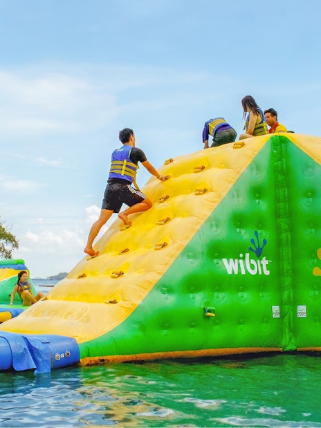 People climbing inflatable obstacle at HydroDash, Singapore.