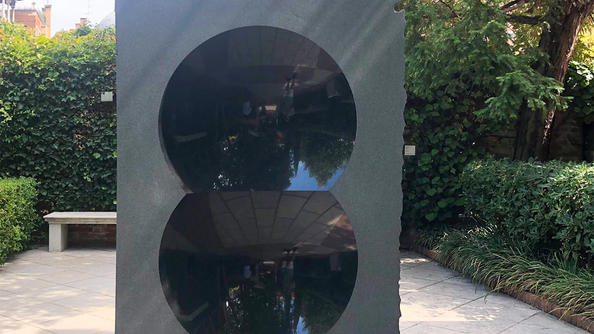 Sculpture with reflective circles at Peggy Guggenheim Museum garden, Venice.