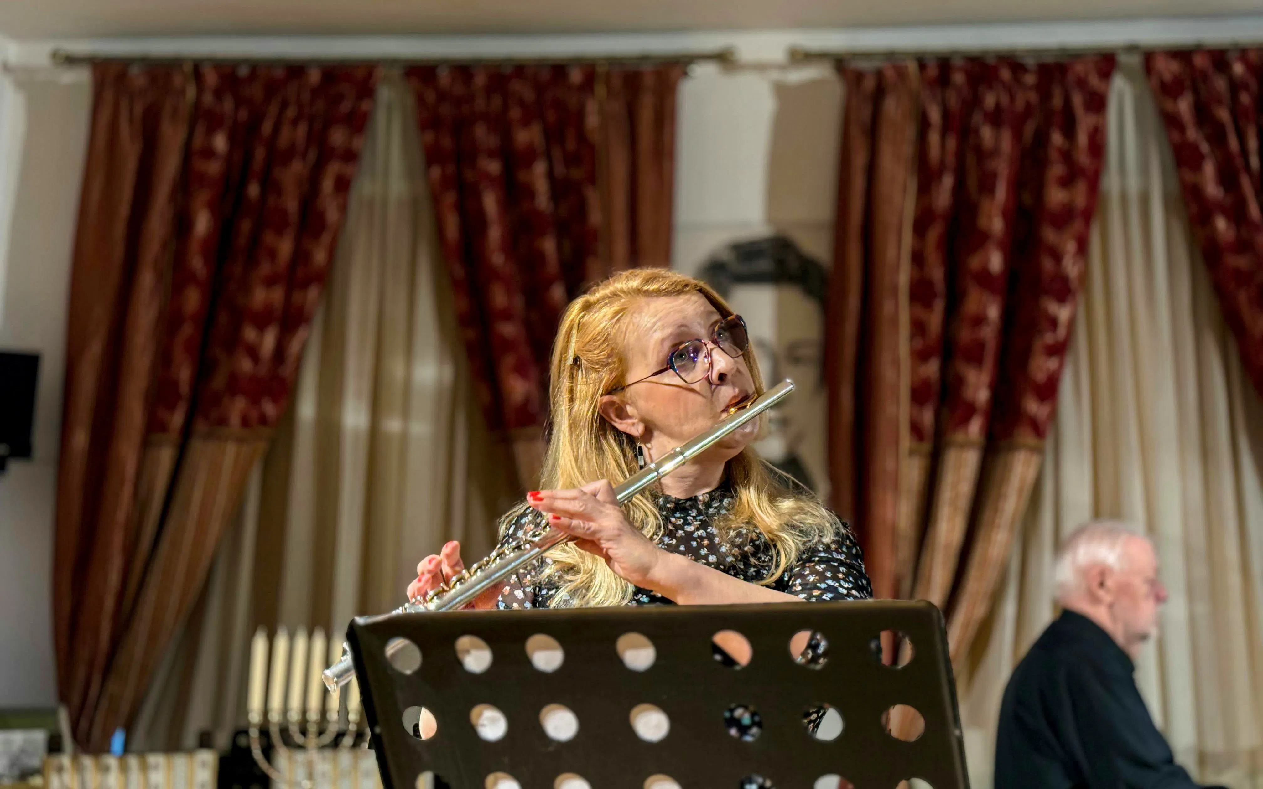 Flutist performing at Jewish style Klezmer music concert in Krakow.