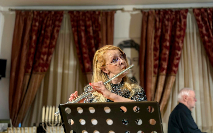 Flutist performing at Jewish style Klezmer music concert in Krakow.