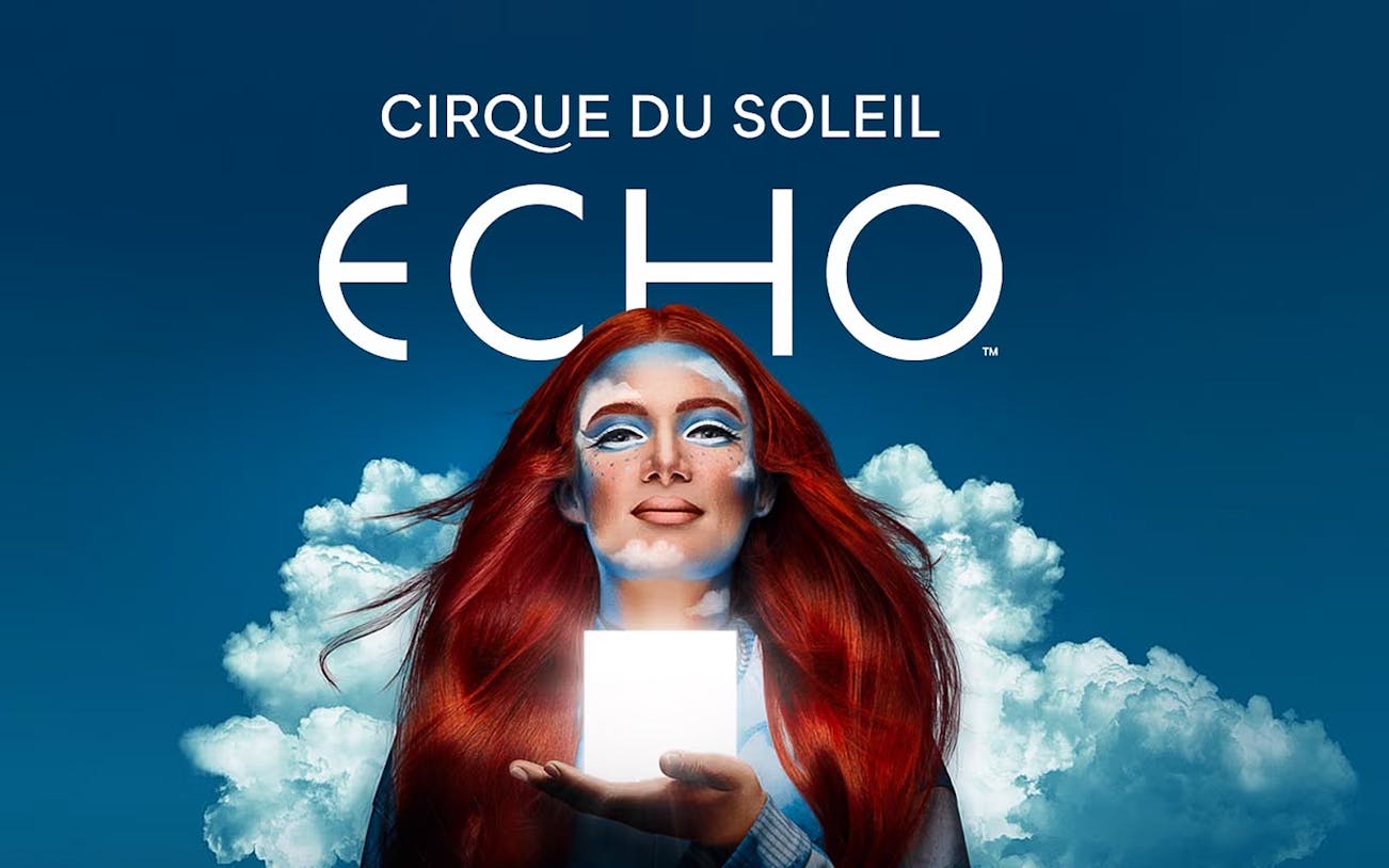 Performer with red hair holding a glowing cube, Cirque Du Soleil ECHO.