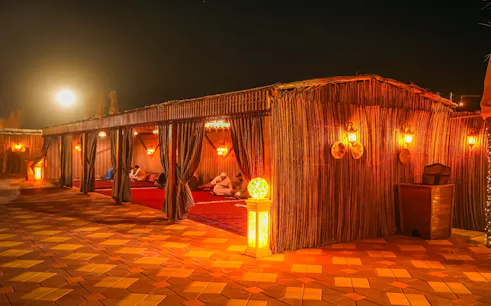 safari por el desierto de dubái con conducción en dunas, paseo en camello, sandboarding, cena a la barbacoa y espectáculos en directo-1