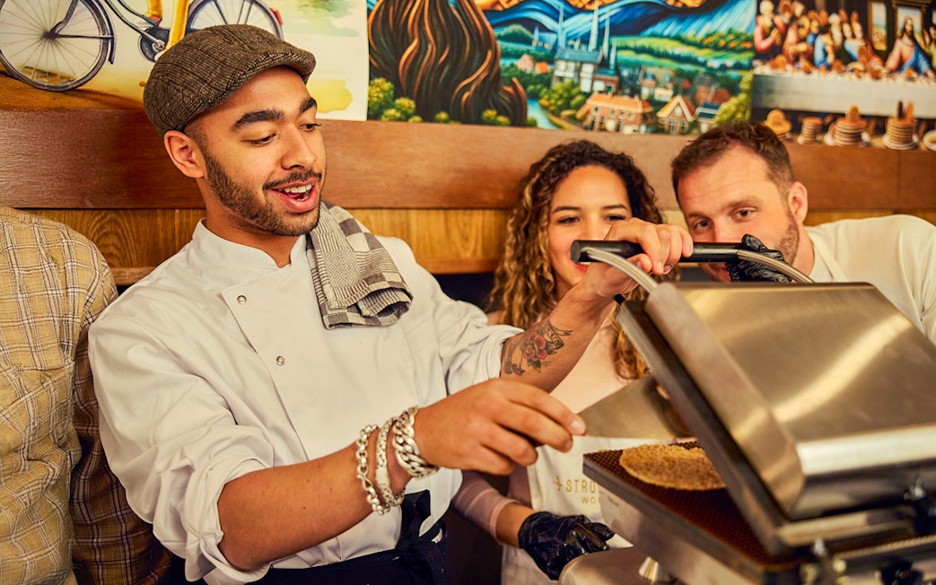Guests learning to make Dutch syrup waffles at a workshop.