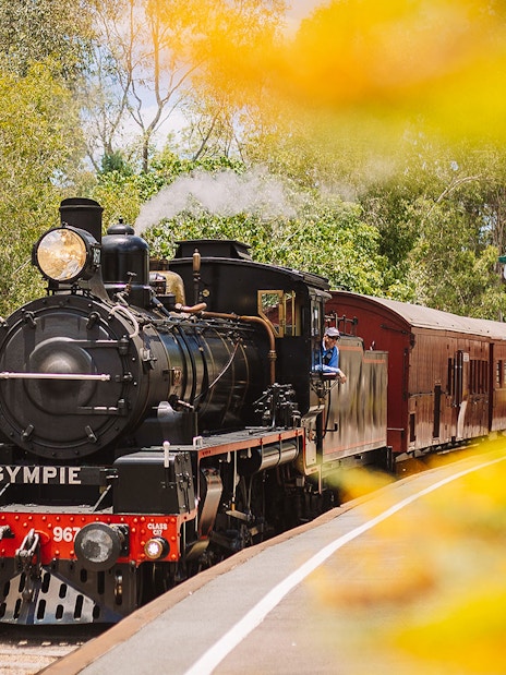 Steam train departing Gympie station on the Mary Valley Rattler experience.