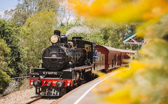 Steam train departing Gympie station on the Mary Valley Rattler experience.