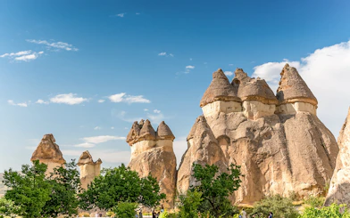 Fairy chimneys in Cappadocia, Turkey, under a clear blue sky.