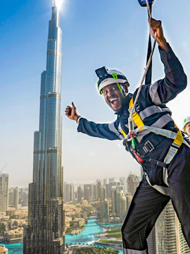 Person ziplining with Burj Khalifa view at Sky Views Observatory, Dubai.